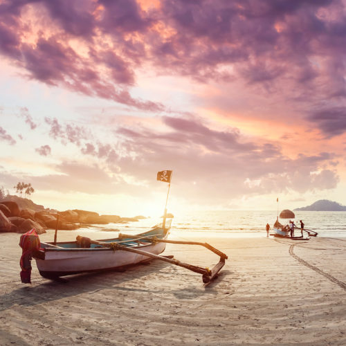 Goa beach. Fishing boat at sun rise